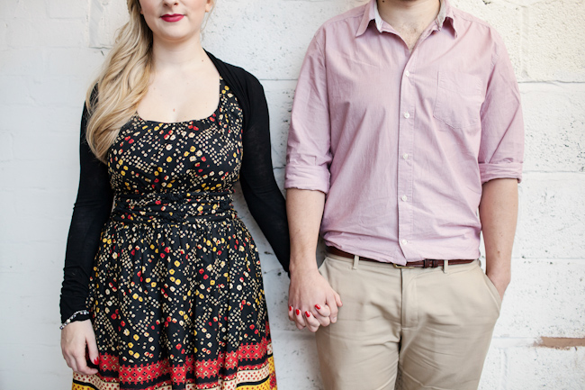 engagement photoshoot couple holding hands middle