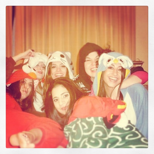 Hens in onesies on bed in Wyndham Hotel