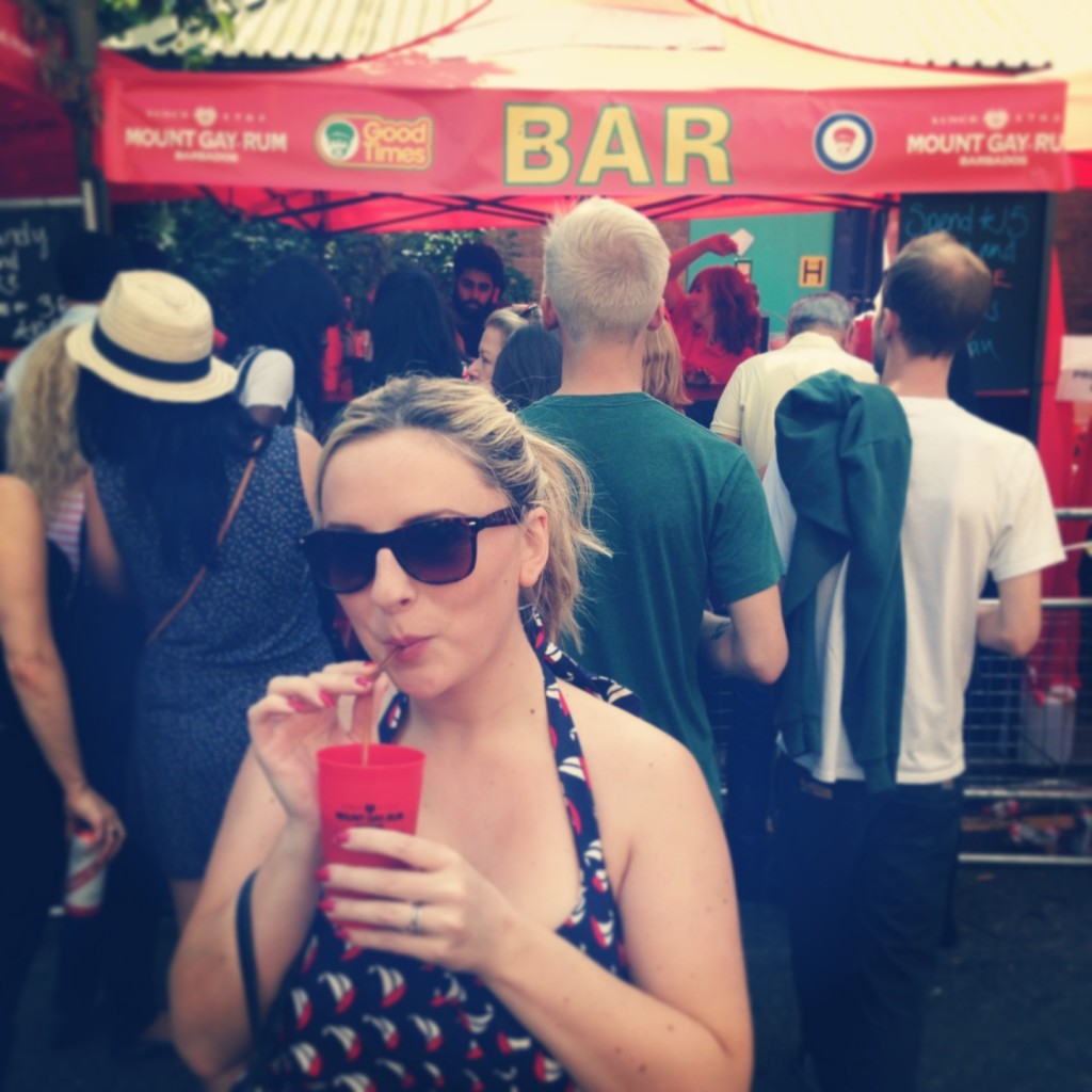hollygoeslightly drinking rum at nottinghill carnival