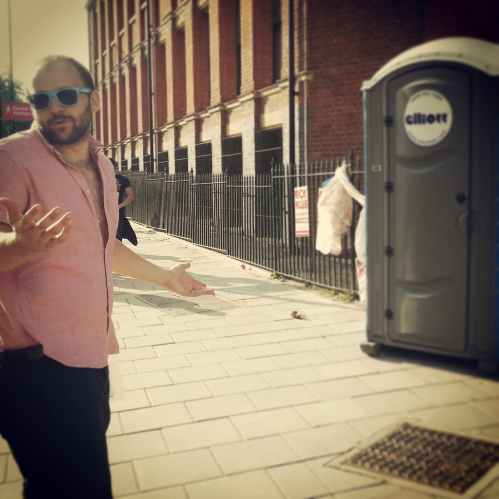 hubby at portaloos notting hill carnival