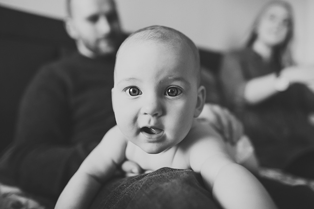 a family lifestyle photoshoot baby looking at camera hollygoeslightly