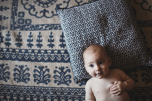 a family lifestyle photoshoot baby on blue rug hollygoeslightly