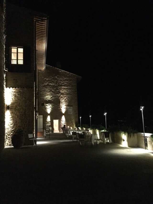 where to eat in tuscany castelfalfi la rocca night terrace hollygoeslightly