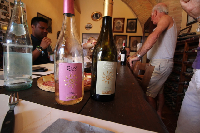 wine tasting in tuscany fattoria fibbiano rose wine bottle hollygoeslightly