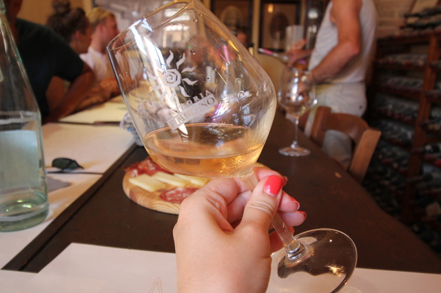 wine tasting in tuscany fattoria fibbiano rose wine glass hollygoeslightly