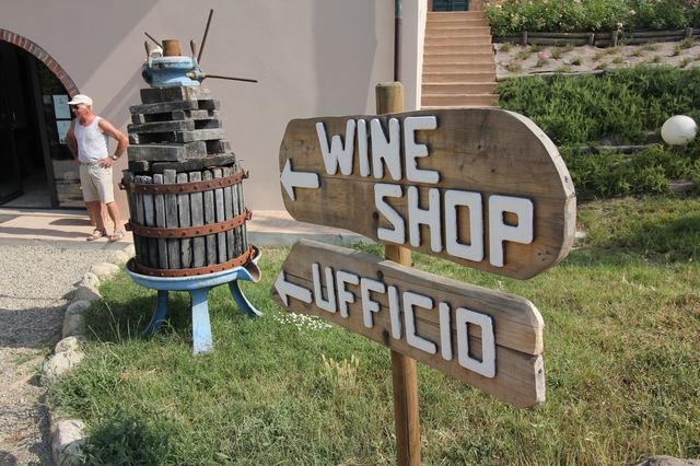 wine tasting in tuscany fattoria fibbiano wine shop wooden sign hollygoeslightly