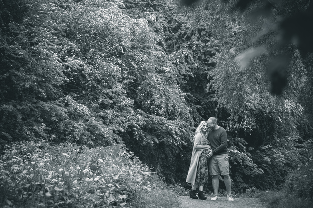 maternity photoshoot in the woods hugging hollygoeslightly