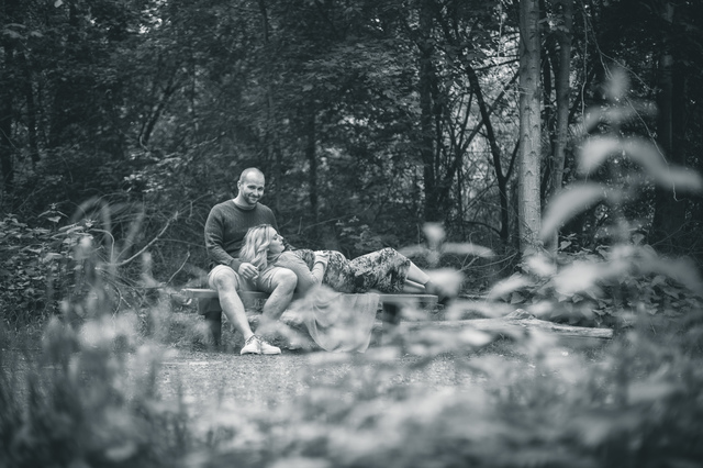 maternity photoshoot in the woods looking through trees hollygoeslightly