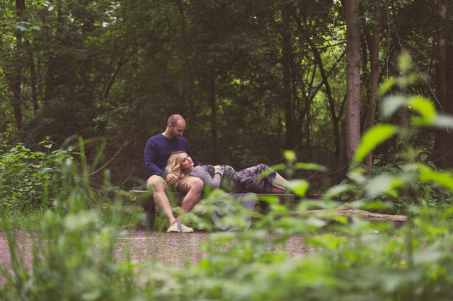 maternity photoshoot in the woods lying on bench hollygoeslightly