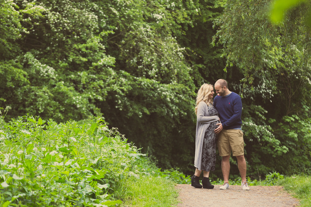 maternity photoshoot in the woods man holding bump hollygoeslightly