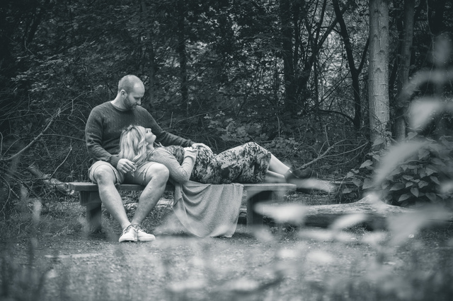 maternity photoshoot in the woods on bench holding bump hollygoeslightly
