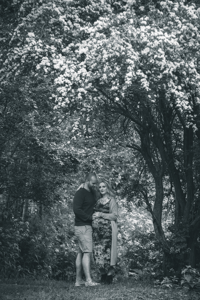 maternity photoshoot in the woods woman looking at camera hollygoeslightly