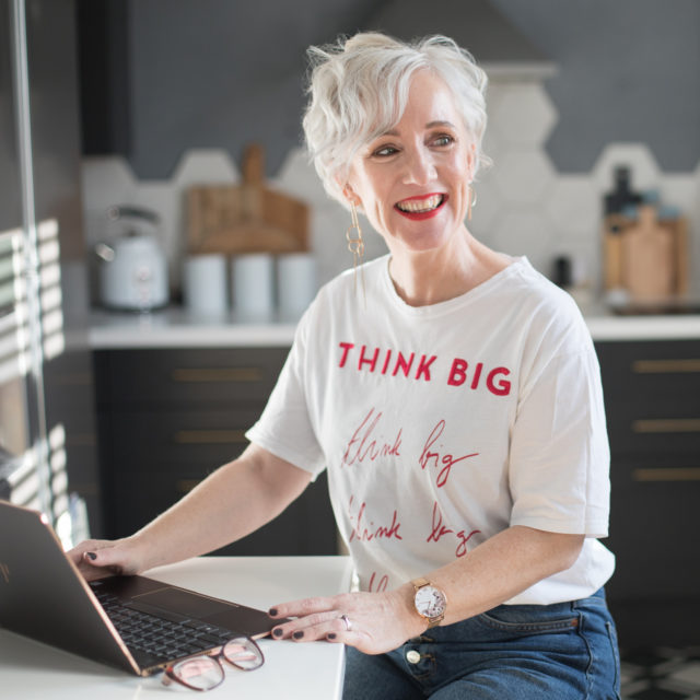 woman entrepreneur jen stanbrook sitting at laptop